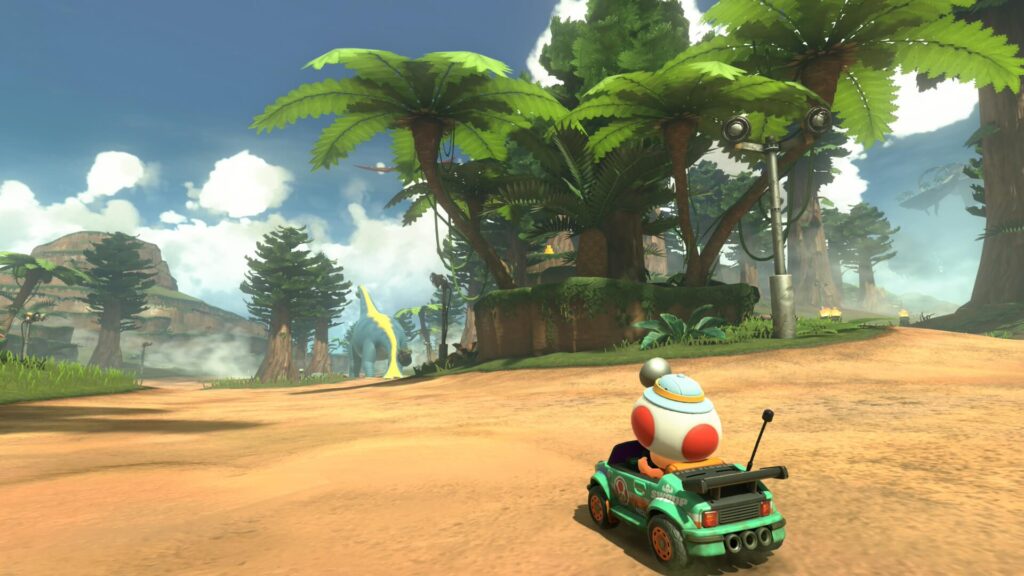 マリオカートワールドにあるディノディノジャングル。キノピオの視線の先にキリン型恐竜がいる。