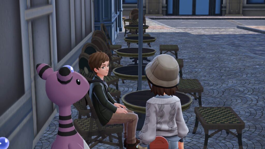 ポケモンレジェンズZAにあるカフェ・カンコドールの隅の席にいる男性客と主人公、色違いデンリュウ