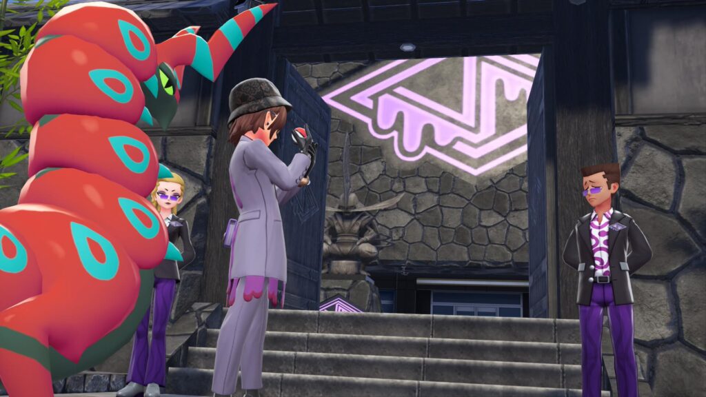 ポケモンレジェンズZAにあるサビ組事務所の門の前でモンスターボールを構える主人公と色違いペンドラー